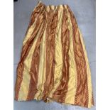 A Pair of lined polyester shot silk bespoke made full length curtains in gold and bronze colours,