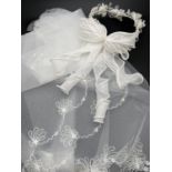 A boxed vintage Pronuptia floral bridal headdress with spiral bow detail to back. Together with a