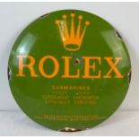 A small circular convex shaped enamelled metal wall advertising sign for Rolex. Approx. 29.5cm