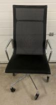 A modern black mesh material and chrome high backed office chair on Cosyland castors.