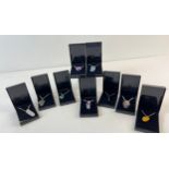 9 boxed natural agate and semi precious stone pendant necklaces. Each pendant is on an 18 inch