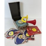 A vintage Kidditunes wind up gramophone in a carry case. Complete with trumpet, needles and a