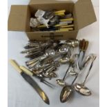 A box of silver plated and stainless steel vintage cutlery. To include carving sets, fish knives and