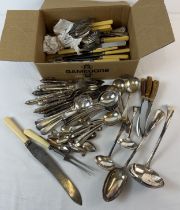 A box of silver plated and stainless steel vintage cutlery. To include carving sets, fish knives and