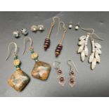 A collection of assorted vintage earrings to include precious metals and gemstones. Lot includes