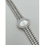 A ladies quartz wrist watch by Roxerina. Strap set with multiple marquis cut and round cut clear