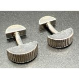 A pair of Tiffany & Co. semi circular shaped cuff links with coin edge detail. Makers marks and