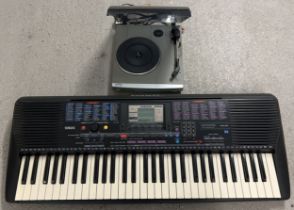 A Yamaha PSR-220 electronic keyboard together with a Bush Acoustics mini turntable.
