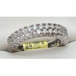 A rhodium plated double row full eternity style cocktail ring set with Swarovski Crystals, new