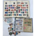 2 vintage stamp albums containing assorted world stamps, together with a few loose stamps.