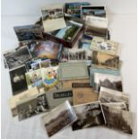 A collection of vintage and antique postcards. To include holiday destinations, booklet