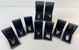 9 boxed natural and semi precious stone pendant necklaces. Each pendant is on a silver or gold