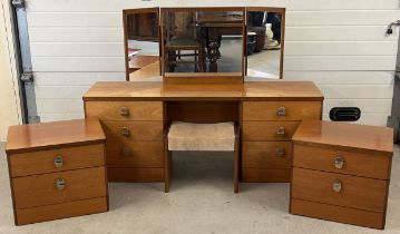 A pair of Stag mid century teak bedside cabinets together with a matching mirror backed dressing