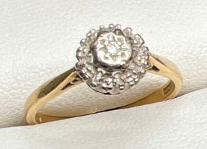 A vintage 18ct gold Illusion set diamond cluster style ring by Ronette. Gold marks to inside of