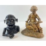 A gilt painted cast metal figurine of a child reading a book together with a vintage 1945