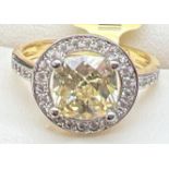 A 14ct gold plated cocktail ring set with Swarovski crystals, new with tags. Halo set cushion cut