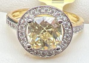 A 14ct gold plated cocktail ring set with Swarovski crystals, new with tags. Halo set cushion cut