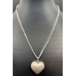 A modern design silver multi strand chain necklace with brushed silver bubble heart pendant, by