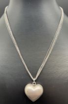 A modern design silver multi strand chain necklace with brushed silver bubble heart pendant, by