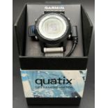 A boxed Garmin Quatix GPS Marine watch with leads. Grey silicone strap with black case and digital