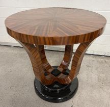 An Art Deco design circular shaped dark wood veneer occasional table with polished finish and