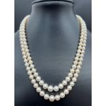 A vintage cream cultured pearl double row necklace with 14ct white gold clasp set with pearls and