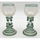 A pair of antique European roemer wine glasses with green tinted detail and grape & vine etched