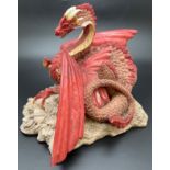 A boxed 1988 limited edition Enchantica "Snarlgard" Autumn dragon figurine by Andrew Bell, for