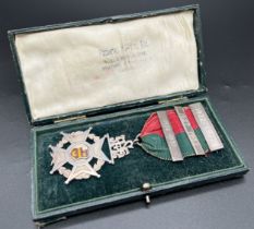 A boxed Fattorini & Sons, Ltd antique silver jewel with ribbon and 3 year date bars. Crescent moon