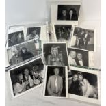 A folder containing over 50 black & white and colour professional photographs of celebrities, actors