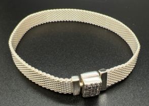 A boxed silver Pandora Reflextions mesh bracelet with clear stone set clasp. Silver and makers marks