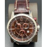 A men's chronograph NY-1324 wristwatch by DKNY. Metallic brown and stainless steel case and face