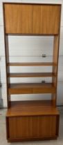 A mid century G Plan wall unit with sliding door cupboard to base and 2 door cupboard to top. With 2