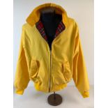 A men's classic Harrington jacket in canary yellow, in as new condition. With red tartan lining,
