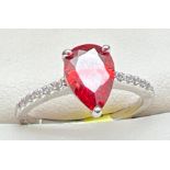 A rhodium plated cocktail ring set with Swarovski crystals, new with tags. Central teardrop cut