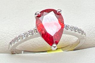 A rhodium plated cocktail ring set with Swarovski crystals, new with tags. Central teardrop cut