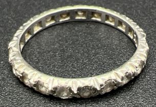 A vintage 9ct white gold full eternity ring set with small round cut clear stones. Gold mark