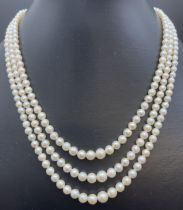 A vintage 3 row string of graduated real cultured pearls with marcasite set fish hook clasp. In a