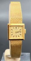 A vintage 18ct gold ladies cocktail watch by The International Watch Co. Mesh bracelet strap with