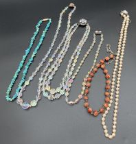 A collection of assorted vintage beaded necklaces, to include faux pearls with 925 silver clasp,