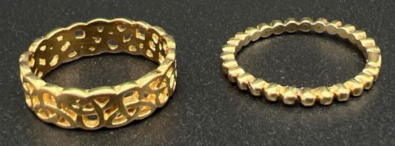 2 silver gilt rings. A pierced design Celtic knot band ring, size LÂ½ together with a thin bubble