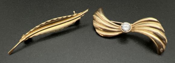 2 vintage gold brooches. A 9ct gold brooch of twist design set with central brilliant cut clear