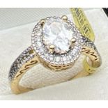 A 14ct gold plated Halo setting cocktail ring set with Swarovski crystals (brand new with tags).
