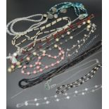 A collection of vintage and modern costume jewellery necklaces. To include black glass bead,