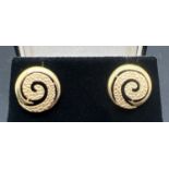 A pair of 9ct gold vintage spiral design stud earrings in both plain and hammered effect finish.