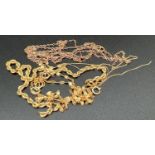 A small quantity of scrap gold chains in various designs. Marked or test as 9ct gold. Total weight