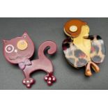 2 lea Stein style Lucite brooches. A maroon coloured cat set with iridescent stones together with