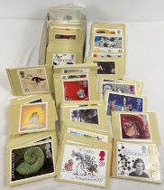 A box of over 200 assorted PHQ Royal Mail stamp postcards.