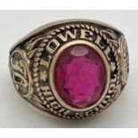 A vintage 1970 10ct gold American Lowell High School signet ring set with an oval red stone -