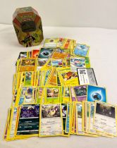 225 assorted Pokemon cards in a 2017 Alola Island Guardians Tapu Koko GX octagonal shaped tin. Cards
